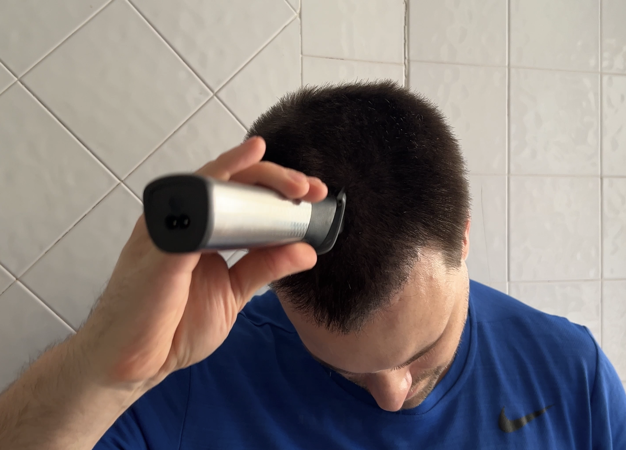 Buzzing my hair with the Philips Norelco Multigroom 9000.